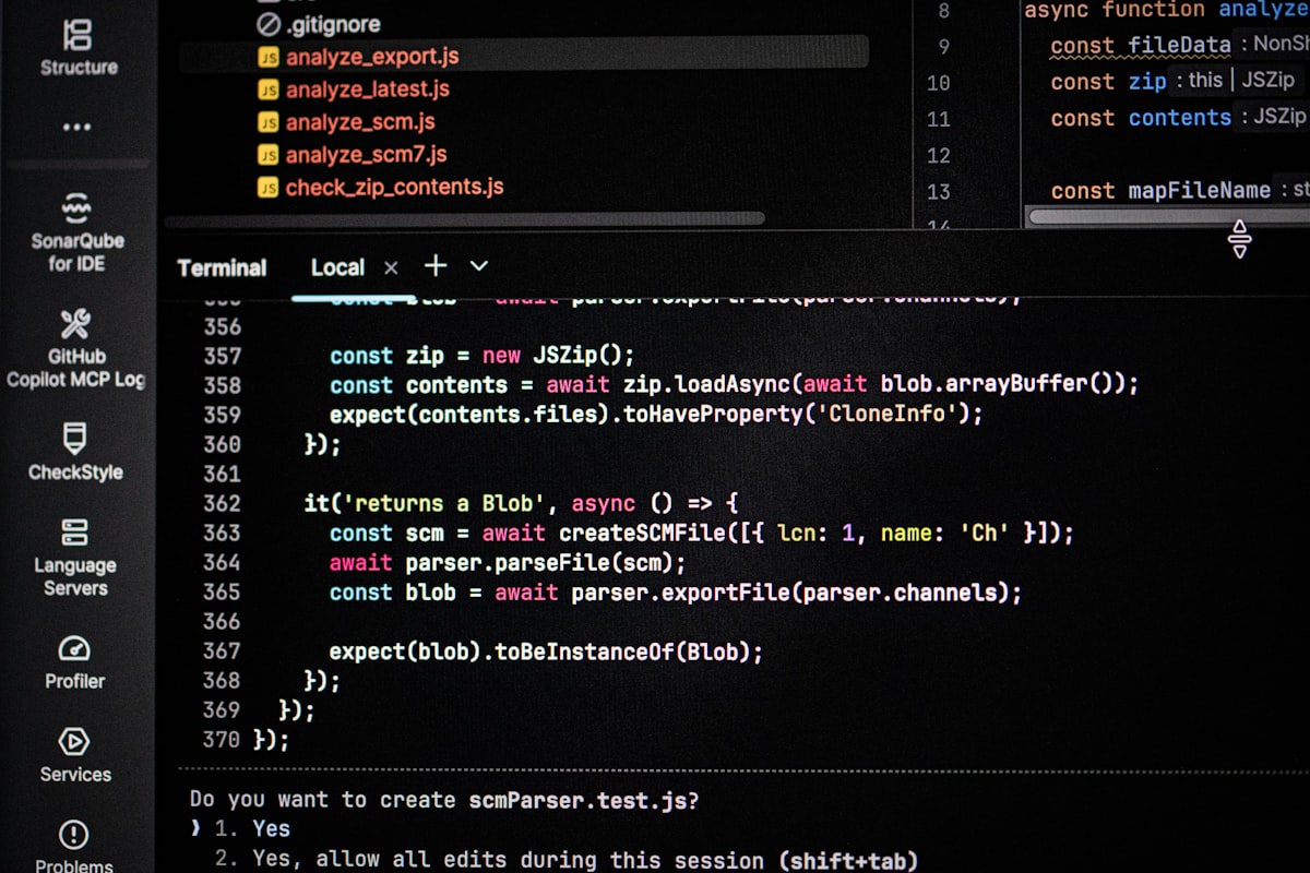 Computer screen displaying code editor and terminal output side by side — developer environment for observability and monitoring